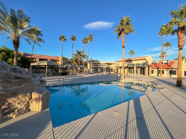 view of swimming pool with a patio