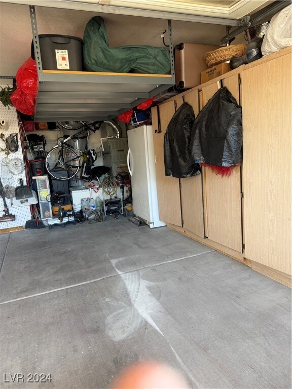 garage featuring white refrigerator