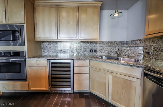 kitchen featuring wine cooler, light brown cabinetry, sink, appliances with stainless steel finishes, and stone counters