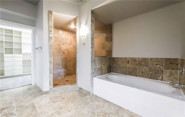 bathroom with separate shower and tub