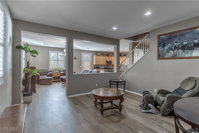 interior space featuring light wood-type flooring and a chandelier