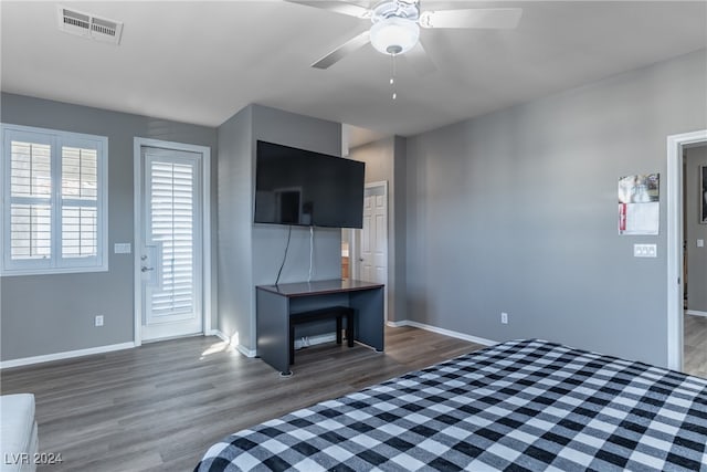 unfurnished bedroom with dark wood-type flooring and ceiling fan