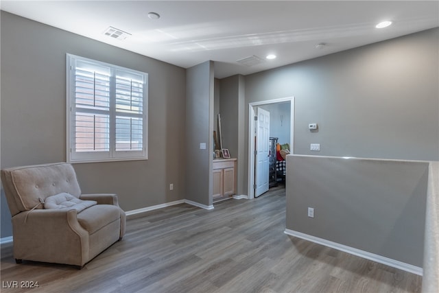 sitting room featuring light hardwood / wood-style floors