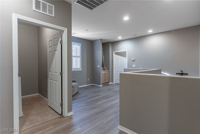 corridor featuring light hardwood / wood-style floors