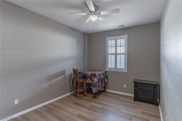 rec room with light hardwood / wood-style flooring and ceiling fan