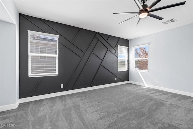 carpeted empty room with ceiling fan