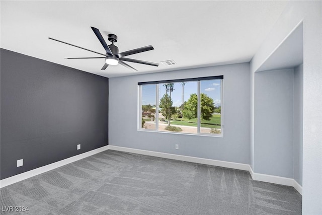 spare room with ceiling fan and carpet floors