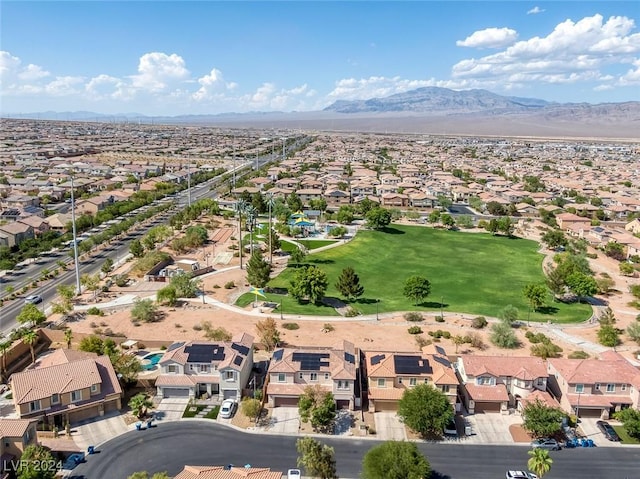 birds eye view of property with a mountain view