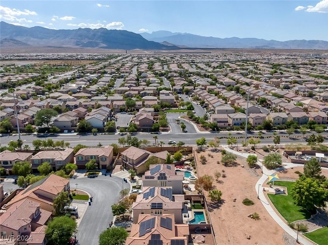 birds eye view of property featuring a mountain view