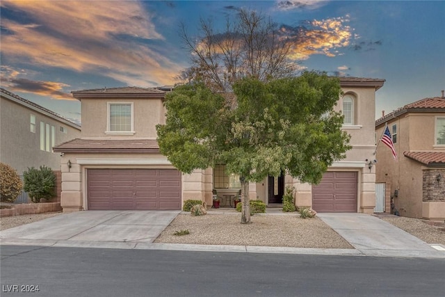 view of front of home with a garage