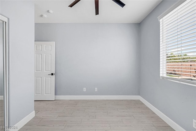 empty room with light hardwood / wood-style flooring