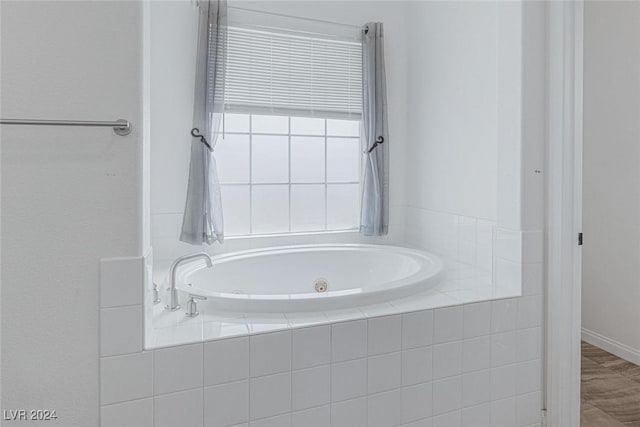 bathroom featuring tiled bath