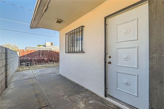 doorway to property with a patio