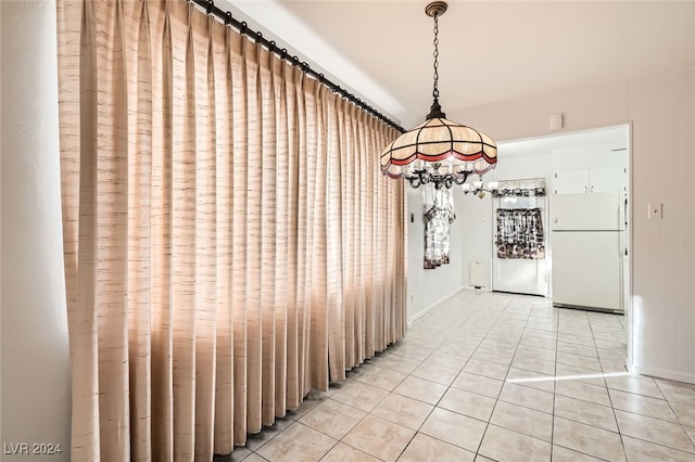 hall with tile patterned flooring