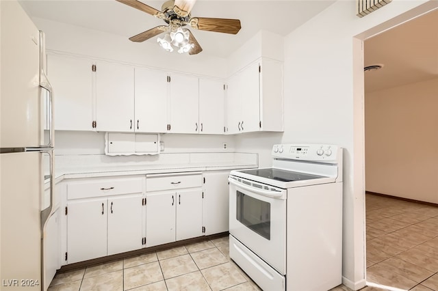 kitchen featuring white cabinets, light tile patterned floors, white appliances, and ceiling fan