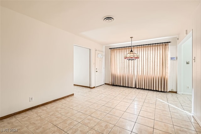 unfurnished room with light tile patterned floors