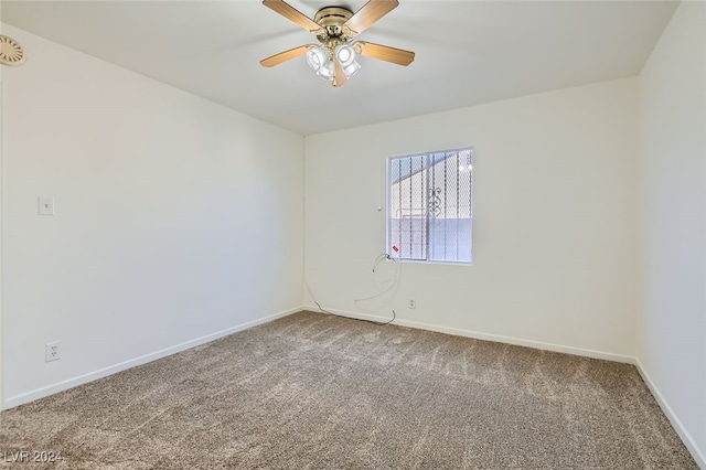 unfurnished room with carpet and ceiling fan