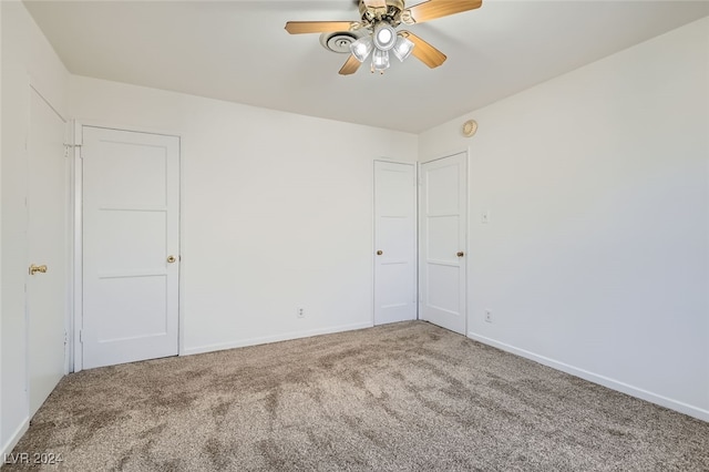 unfurnished room with carpet flooring and ceiling fan