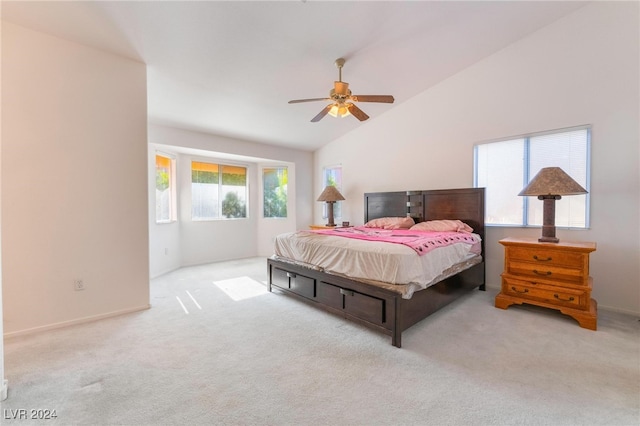 carpeted bedroom featuring high vaulted ceiling, multiple windows, and ceiling fan