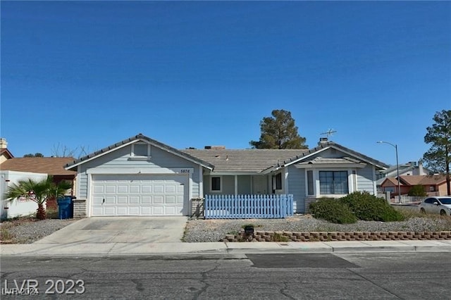 ranch-style house featuring a garage