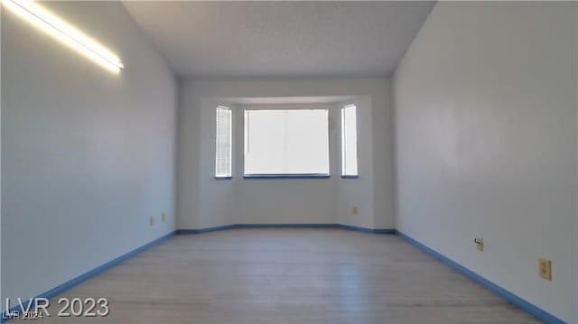 spare room featuring hardwood / wood-style flooring