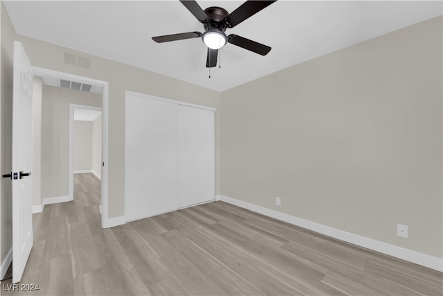 spare room featuring ceiling fan and light hardwood / wood-style floors