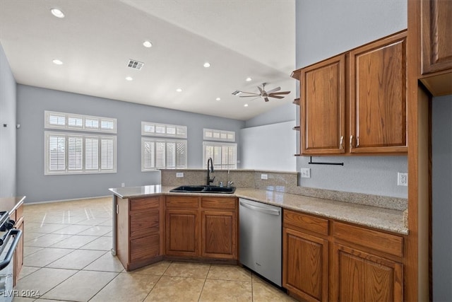 kitchen featuring kitchen peninsula, appliances with stainless steel finishes, sink, and plenty of natural light