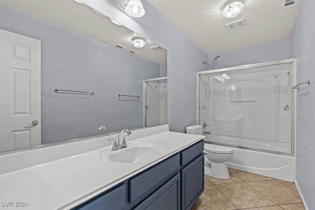 full bathroom featuring vanity, tile patterned floors, toilet, and shower / bathtub combination