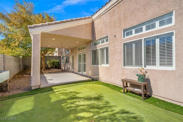 back of house featuring a patio