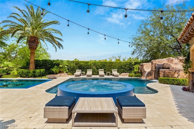 view of pool featuring an in ground hot tub and a patio area