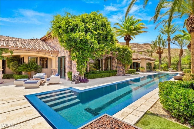 view of swimming pool featuring a patio