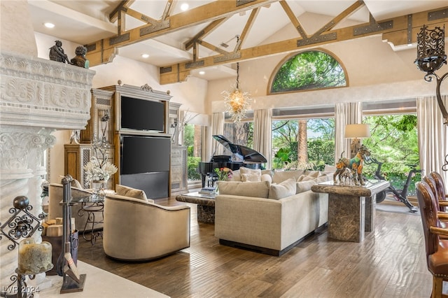 living room featuring high vaulted ceiling, hardwood / wood-style floors, beamed ceiling, and an inviting chandelier