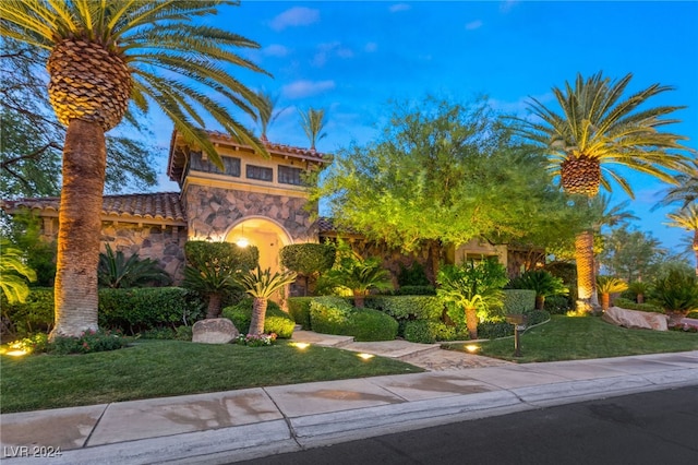 view of front of home with a lawn