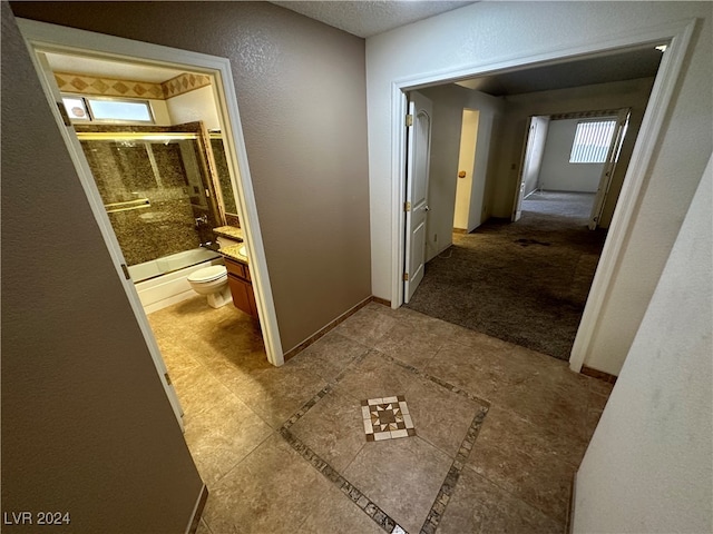 hallway featuring tile patterned floors