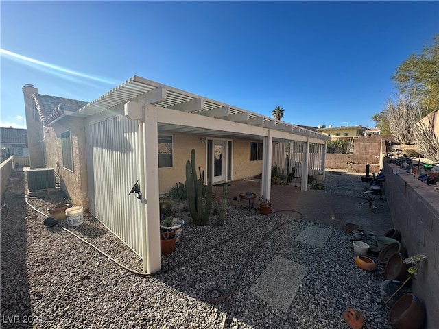 view of home's exterior with a pergola, central air condition unit, and a patio