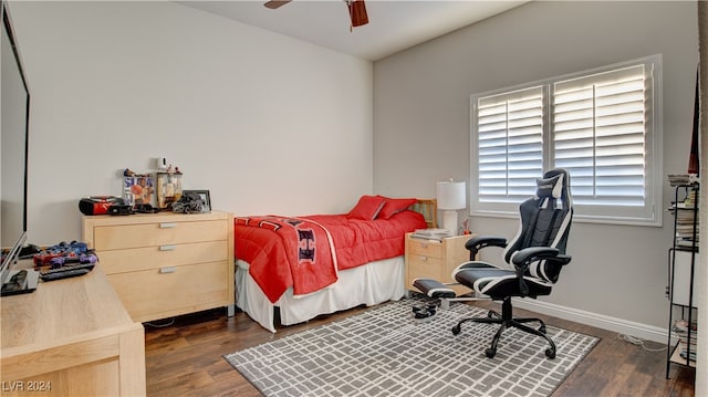 bedroom featuring dark wood-type flooring and ceiling fan