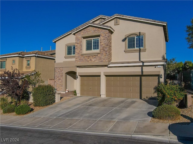 view of front of property with a garage