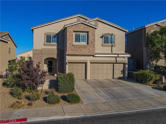 view of front of property with a garage