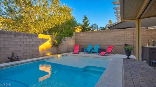 view of pool featuring a patio area