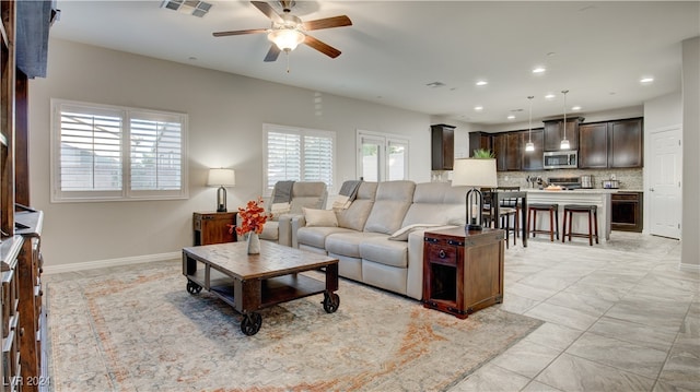 living room with ceiling fan