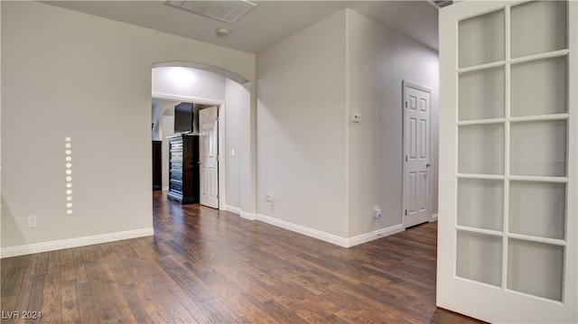 spare room featuring dark hardwood / wood-style flooring