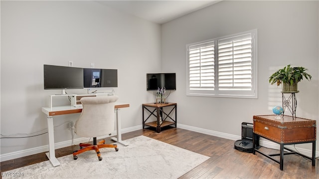 office with hardwood / wood-style flooring