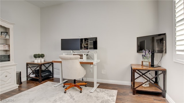 office with dark hardwood / wood-style flooring