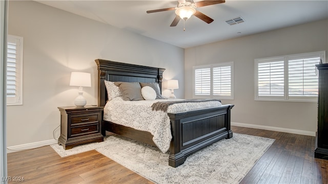 bedroom with ceiling fan and hardwood / wood-style floors