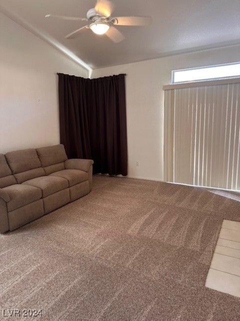 unfurnished living room with carpet flooring, ceiling fan, and lofted ceiling