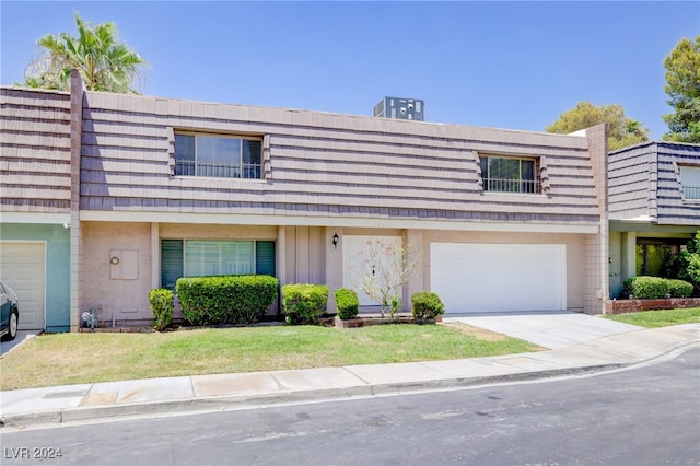 multi unit property featuring a garage