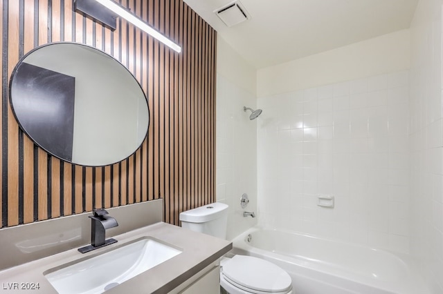 full bathroom featuring vanity, toilet, and tiled shower / bath combo