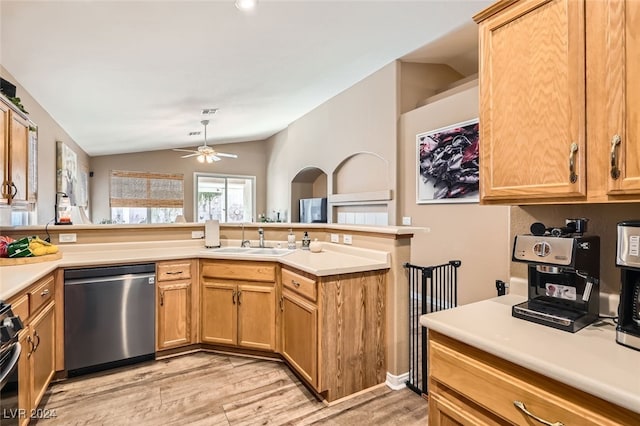 kitchen featuring sink, light hardwood / wood-style flooring, stainless steel dishwasher, kitchen peninsula, and vaulted ceiling