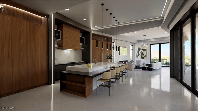 kitchen with a kitchen breakfast bar, a spacious island, decorative backsplash, and decorative light fixtures