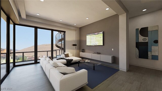 living room featuring hardwood / wood-style flooring and a mountain view